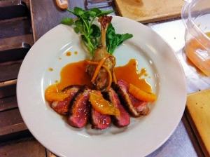 Sauteed duck breast and braised leg with orange sauce